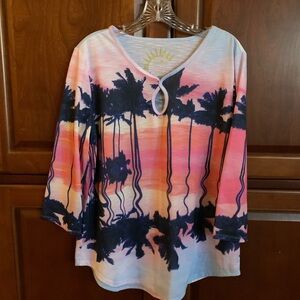 Large tropical print long sleeve knit shirt.